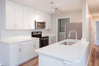 Quartz countertops & tile backsplash *